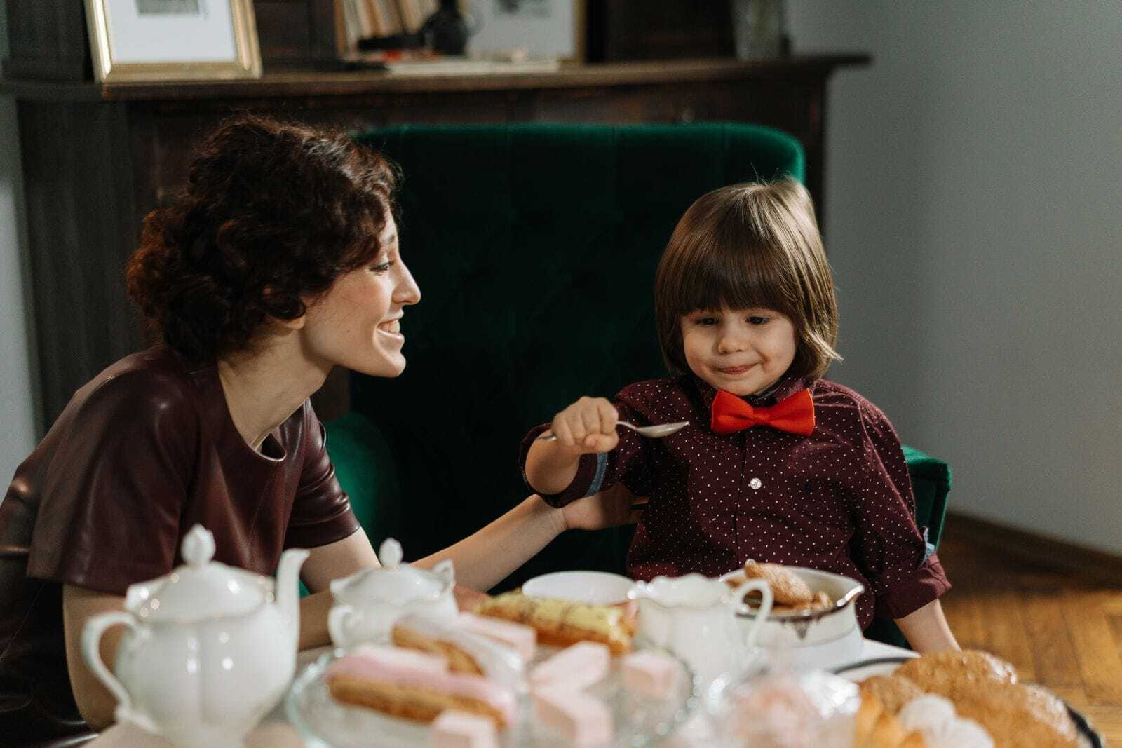 Experienced nanny sharing a quiet bonding moment with a young child during everyday care